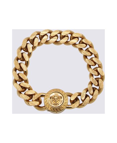 versace bransoletka|Versace goldtone bracelet.